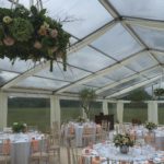 Wedding Themed Marquee Hire With Floral Dressed Tables And Clear Roof