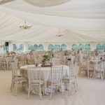 Internal Marquee image with draping ceiling and chandelier lighting